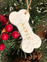 Load image into Gallery viewer, Dog Christmas Decoration - Bone Bauble - White Clay Paw Prints - Dog Bone - Jute Twine
